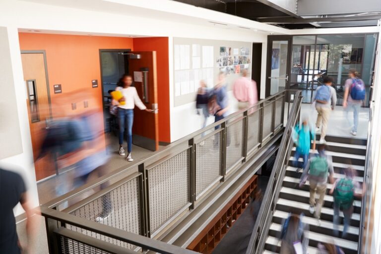 Students walking through the halls of school.